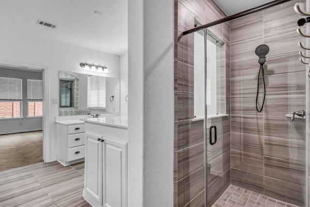 bathroom with vanity and an enclosed shower