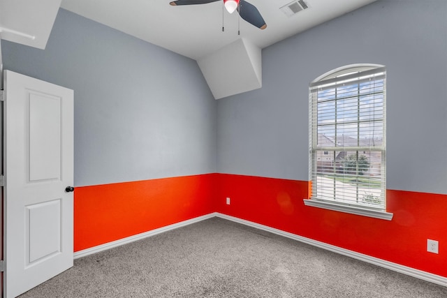 unfurnished room featuring ceiling fan, carpet, and vaulted ceiling