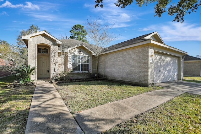 ranch-style house featuring a garage and a front lawn