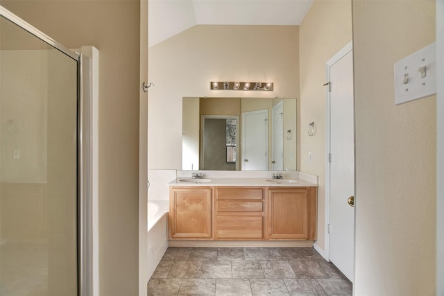 bathroom with vanity, separate shower and tub, and lofted ceiling