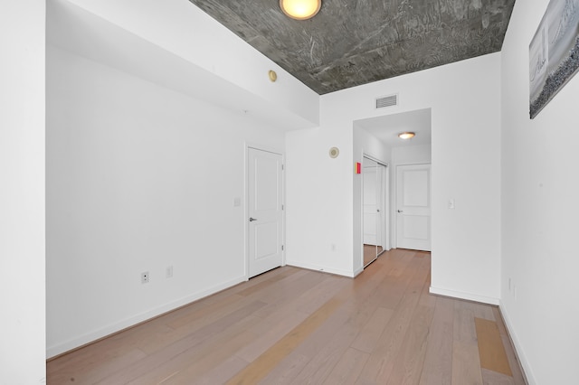 unfurnished room featuring wood-type flooring