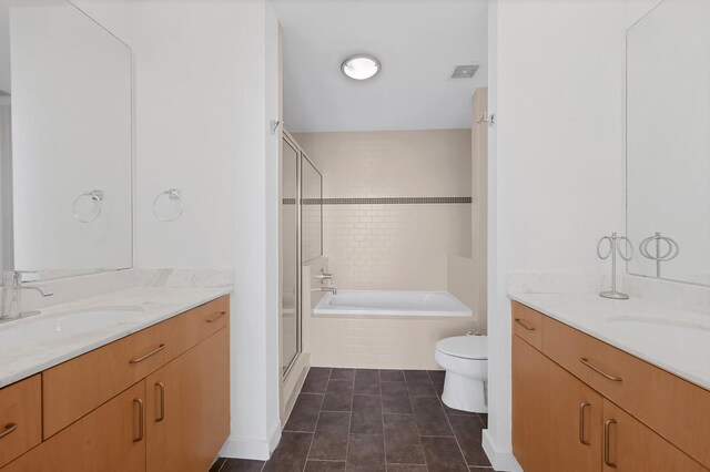 full bathroom with tile patterned floors, toilet, independent shower and bath, and vanity