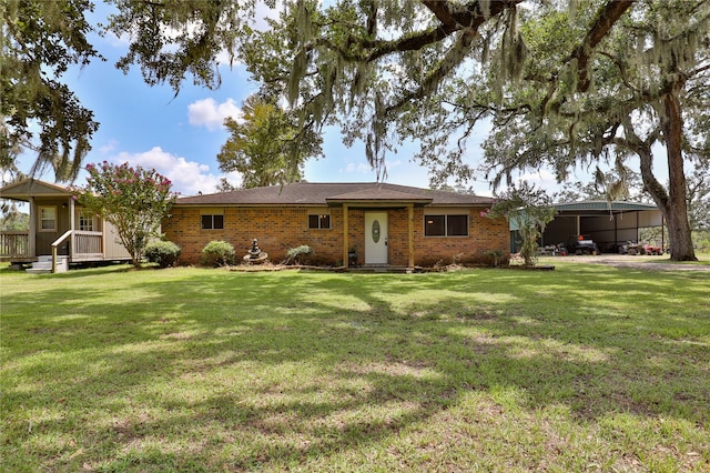 ranch-style house featuring brick siding and a front yard