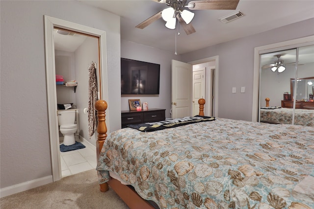 tiled bedroom with a closet and ceiling fan