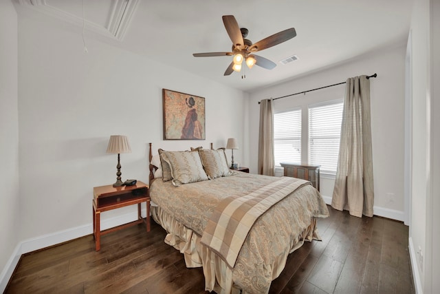 bedroom with ceiling fan and dark hardwood / wood-style floors