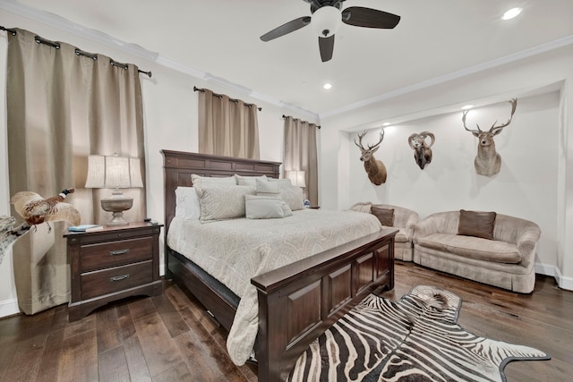 bedroom with crown molding, ceiling fan, and dark wood-type flooring