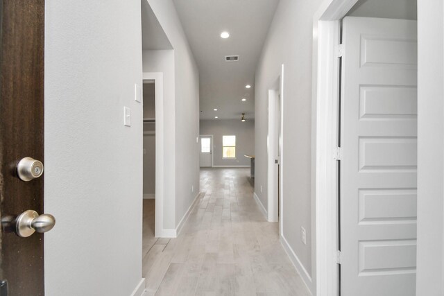 corridor featuring light hardwood / wood-style floors