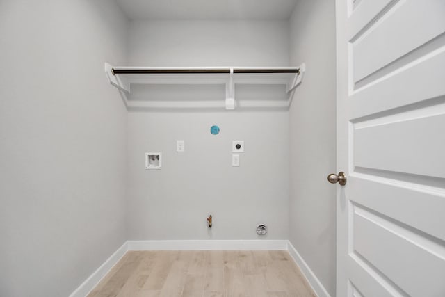 22022 Villa Terrace Dr, Hockley, TX 77447 - laundry room with light wood-type flooring, hookup for a washing machine, hookup for a gas dryer, and hookup for an electric dryer