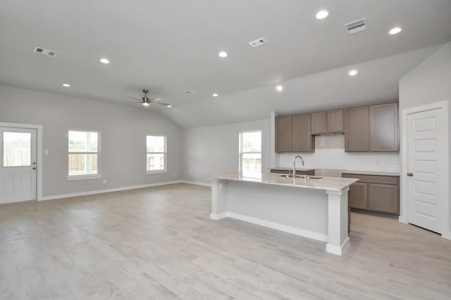 22022 Villa Terrace Dr, Hockley, TX 77447 - kitchen featuring sink, ceiling fan, a center island with sink, and light hardwood / wood-style floors