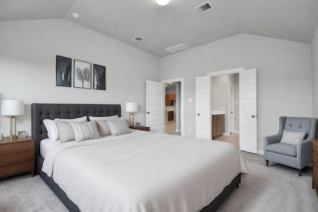 22022 Villa Terrace Dr, Hockley, TX 77447 - bedroom featuring vaulted ceiling, ensuite bathroom, and light carpet