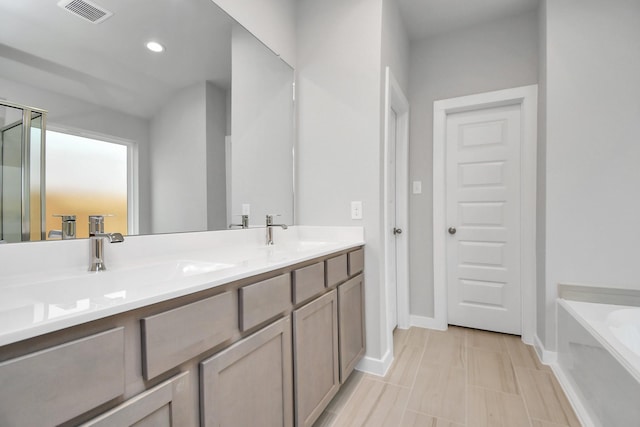 22022 Villa Terrace Dr, Hockley, TX 77447 - bathroom featuring plus walk in shower, vanity, and tile patterned floors
