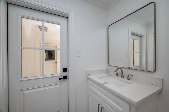 bathroom featuring vanity and crown molding