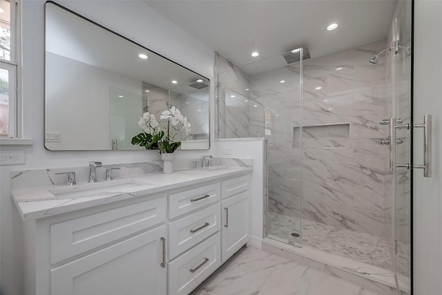 bathroom with vanity and walk in shower