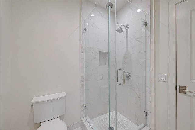 bathroom with toilet and walk in shower