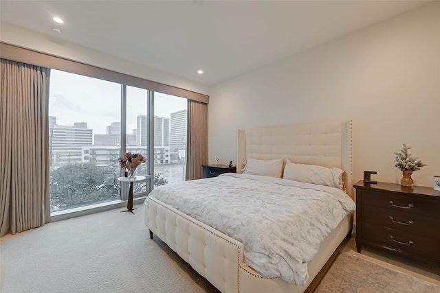 bedroom featuring light carpet