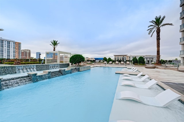 view of pool with pool water feature