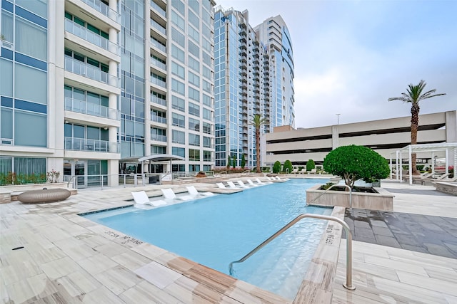 view of pool featuring a patio