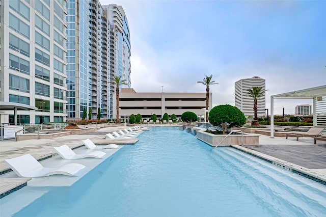 view of swimming pool with a patio