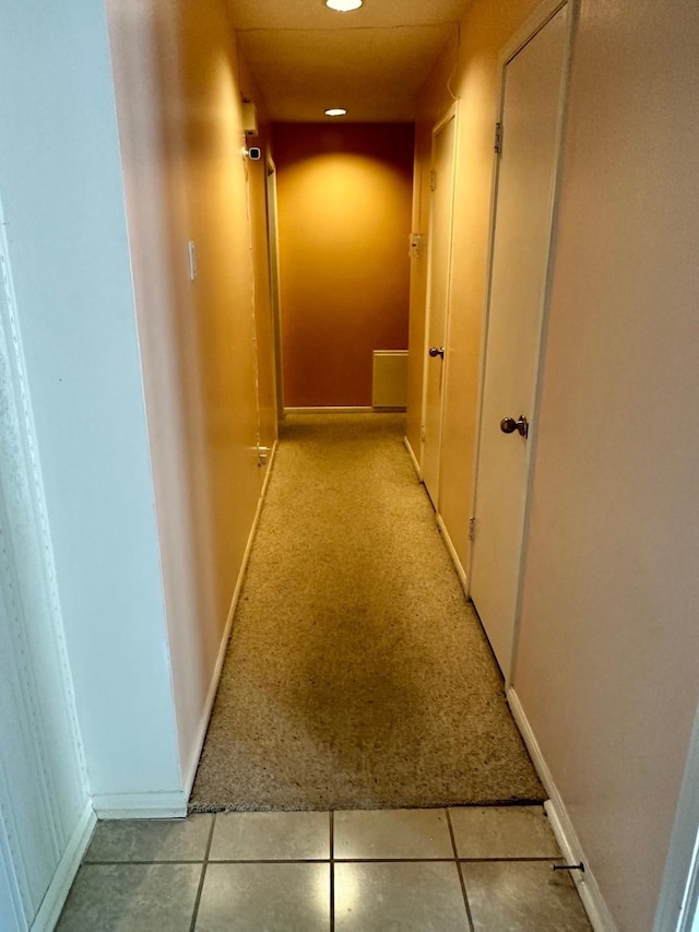 corridor with light tile patterned flooring