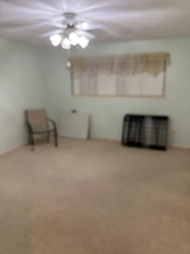 unfurnished room featuring carpet flooring and ceiling fan