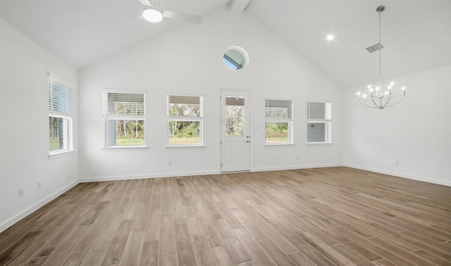 unfurnished living room featuring hardwood / wood-style flooring, ceiling fan with notable chandelier, high vaulted ceiling, and beamed ceiling