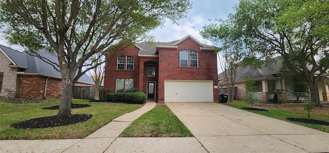 view of front property with a garage and a front yard