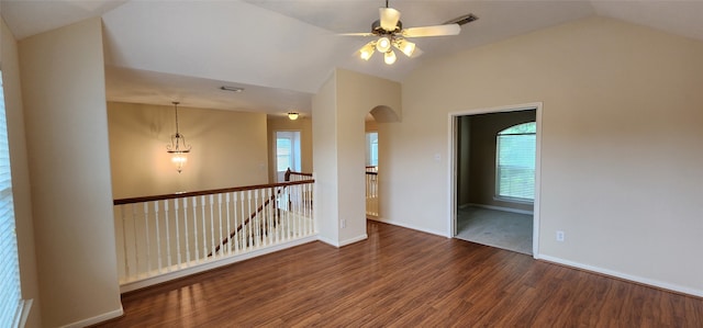 unfurnished room featuring vaulted ceiling, ceiling fan, and dark hardwood / wood-style floors