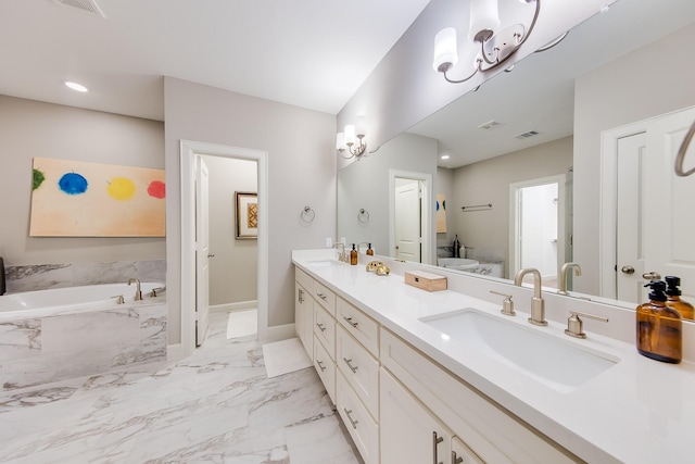 bathroom with a garden tub, a sink, baseboards, marble finish floor, and double vanity