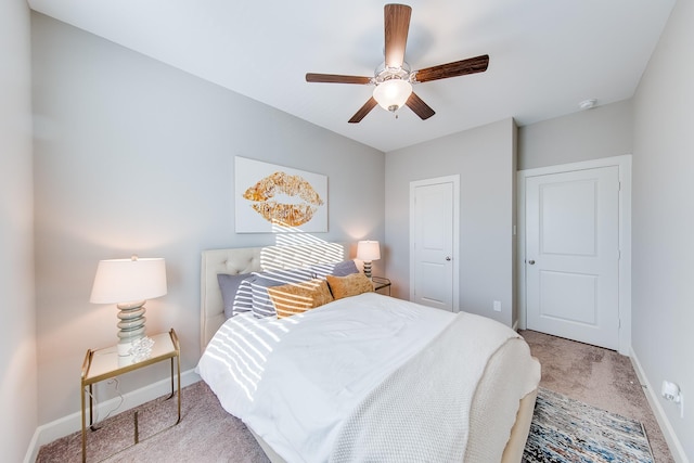 bedroom with carpet floors, a ceiling fan, and baseboards