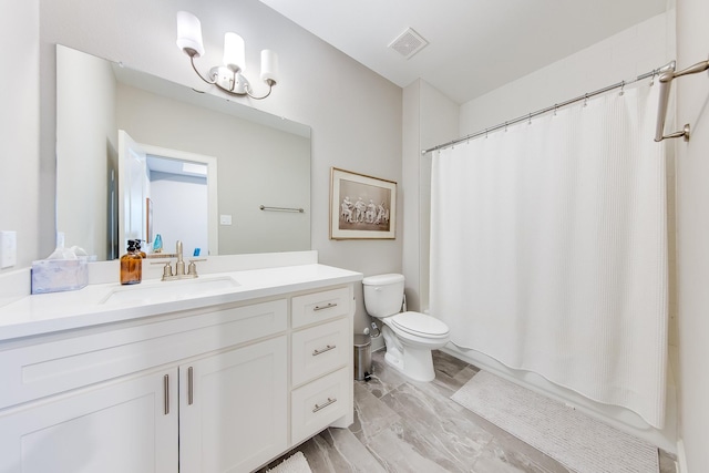 full bathroom with toilet, shower / bath combo, vanity, and visible vents