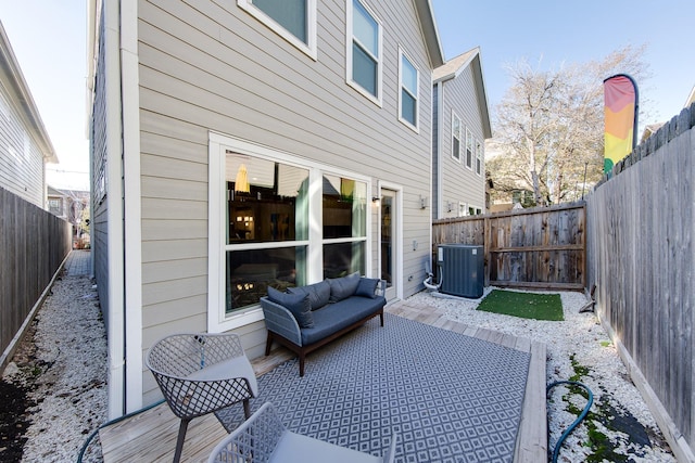 view of patio / terrace with a fenced backyard and central air condition unit