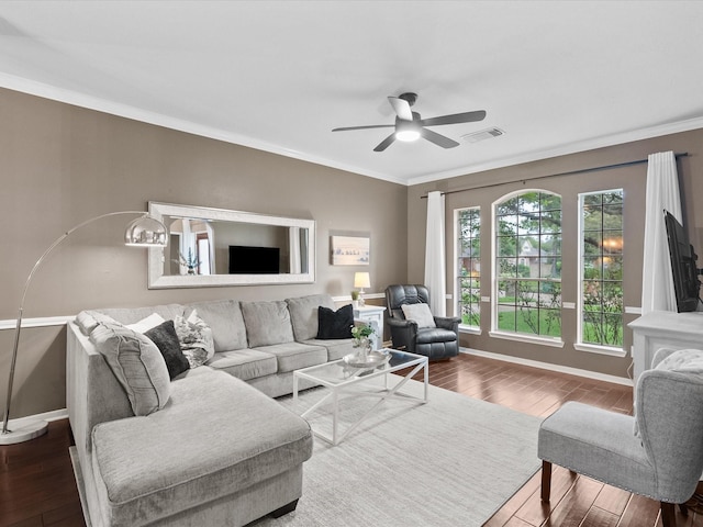 living room with ceiling fan, wood-type flooring, and ornamental molding