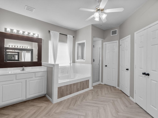 bathroom with parquet floors, ceiling fan, vanity, and plus walk in shower