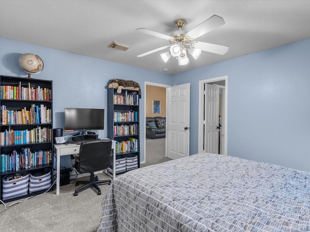 bedroom with ceiling fan and carpet flooring