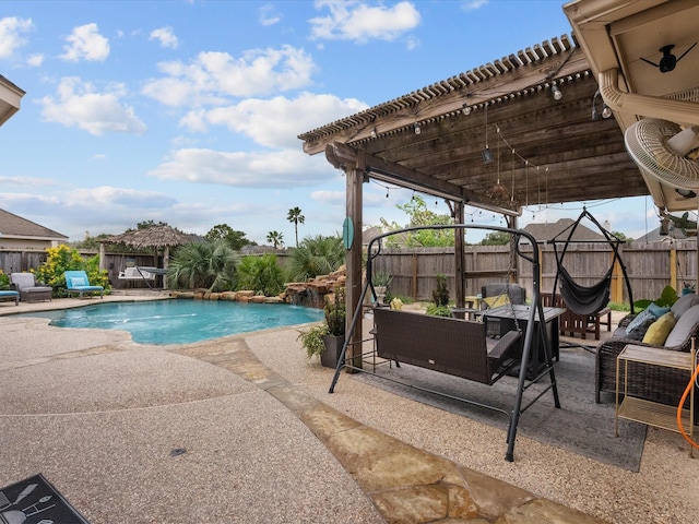 view of swimming pool featuring a patio, an outdoor living space, and pool water feature