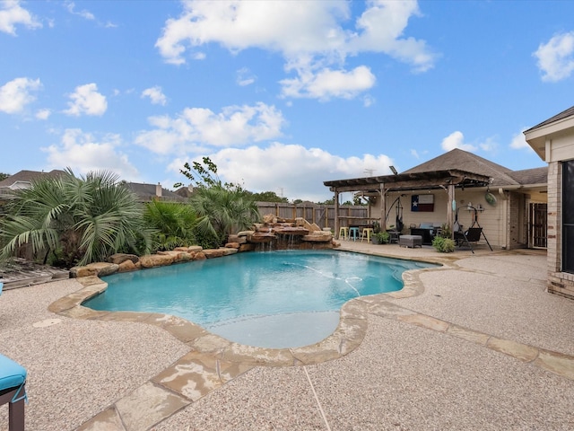 view of pool with pool water feature and a patio area