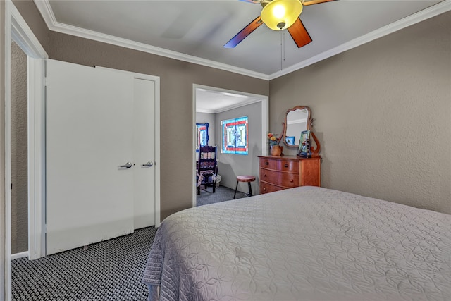 bedroom featuring carpet flooring, ceiling fan, and crown molding