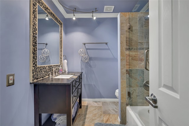 full bathroom with crown molding, toilet, vanity, and bath / shower combo with glass door