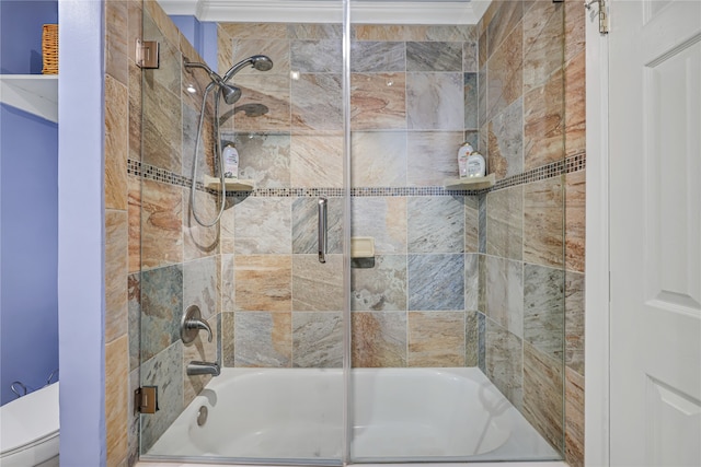 bathroom with bath / shower combo with glass door and toilet