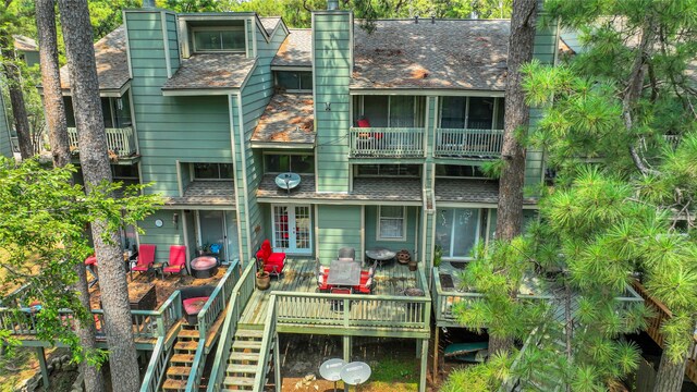 back of property featuring a deck