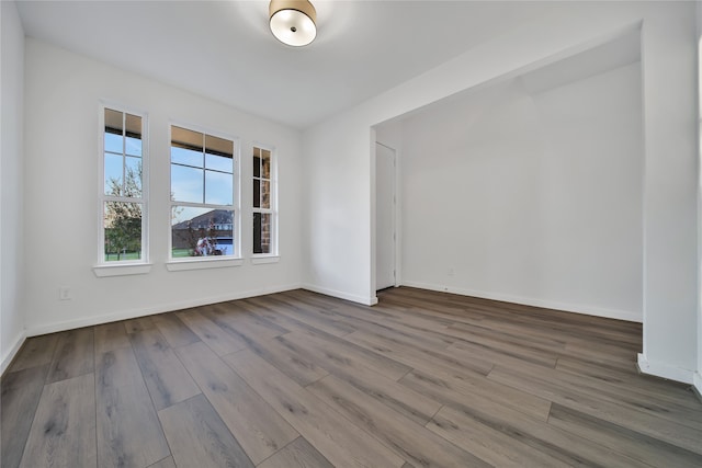 unfurnished room featuring hardwood / wood-style floors