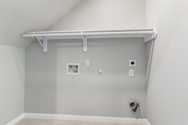 clothes washing area with hookup for a washing machine, electric dryer hookup, and gas dryer hookup