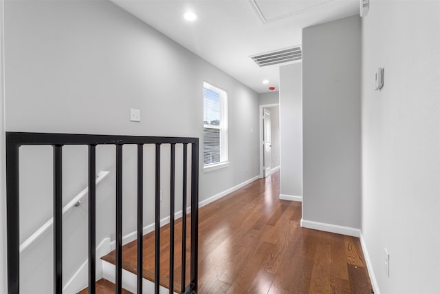 hall with dark hardwood / wood-style flooring