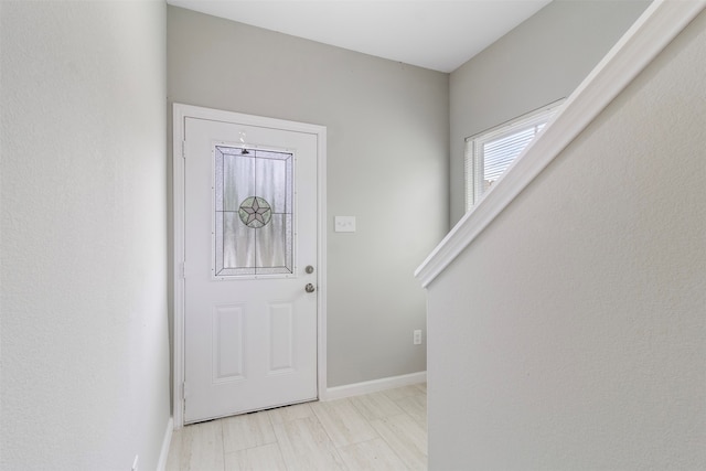 entryway with light tile patterned flooring