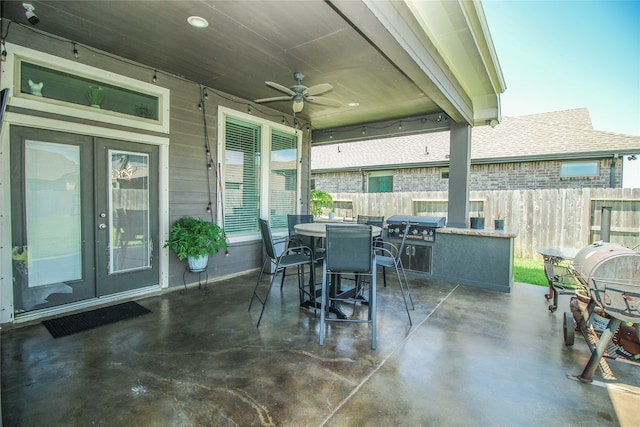 view of patio featuring ceiling fan and a grill