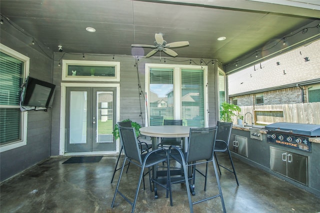 view of patio / terrace with ceiling fan, sink, a grill, and exterior kitchen