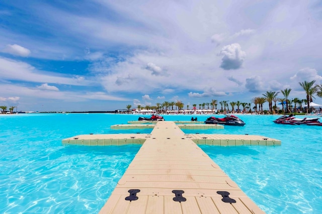 view of swimming pool featuring a water view