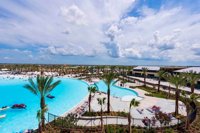 view of pool with a water view