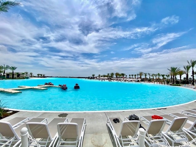 view of pool with a water view