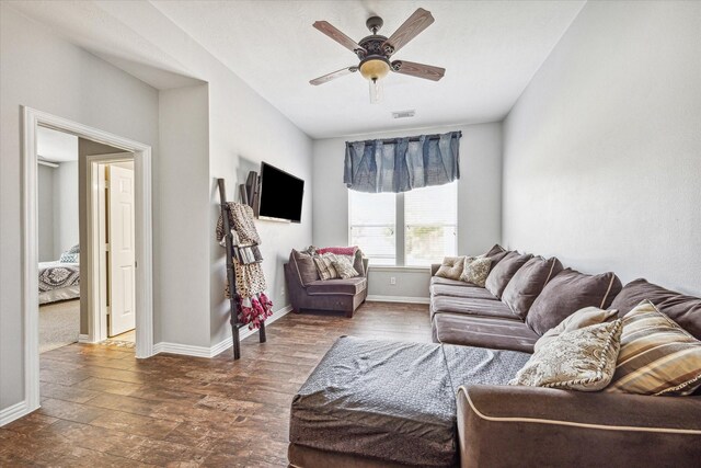 living room featuring ceiling fan and hardwood / wood-style flooring